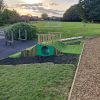 Bank play area with tunnel and activity trail equipment at Minchinhampton School