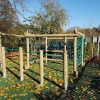 Wide view of timber rope play frame in a playground
