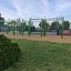 Green playground play frame with climbing and movement route