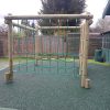 Installed rope climbing play frame in a playground