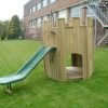 Playground turret with slide and raised timber platform