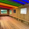 Interior benches inside Rainbow Roof Outdoor Classroom