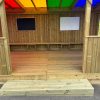 Interior entrance and seating inside Rainbow Roof Outdoor Classroom
