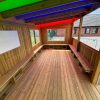 Colourful roof panels inside Rainbow Roof Outdoor Classroom