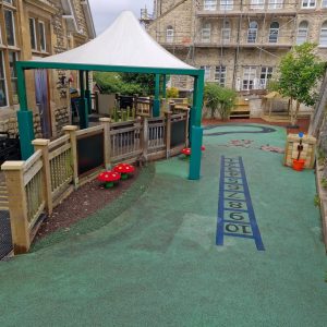 Stroud Valley EY complete early years playground with shelter, roadway markings and play features
