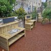 Stroud Valley EY mud kitchen units on rubber mulch surfacing