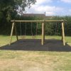 Installed timber playground swing with flat seats