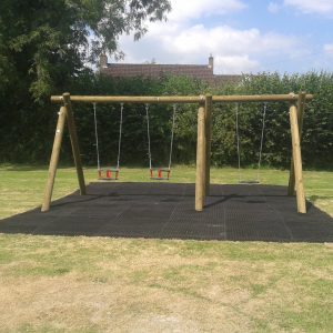 Installed timber playground swing with flat seats