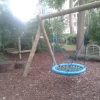 Wide view of basket swing in a playground