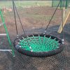 Close view of basket swing seat and ropes