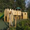Thrupp adventure play installation with turret, bridge and slide