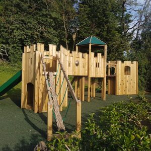 Thrupp adventure play installation with turret, bridge and slide