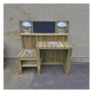 Timber mud kitchen with bowls and chalkboard