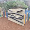 Drain pipe water play wall with channels and rainbow fencing