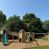 Wide garden multi combo installation with slide bridge and swing frame