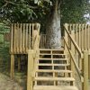 Central steps leading into a raised tree play platform