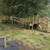 King Edward's School Bath tree play structure with raised platforms and steps