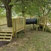 Tree play platforms with steps and crawl tunnel at King Edward's School Bath