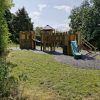 King Edward's School multi adventure play in a grassed outdoor play space