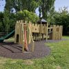 Wide view of King Edward's School multi adventure play with slide and linked towers