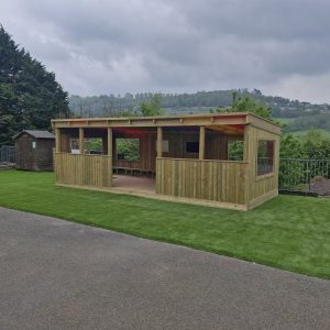 Stroud Valley outdoor learning area with rainbow roof shelter and play space