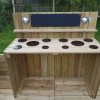 Bespoke mud kitchen layout on timber deck