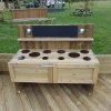 Bespoke outdoor mud kitchen with play hob and seating