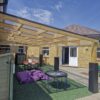 Timber school canopy with clear roof panels at Bussage