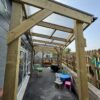 Covered outdoor play space beneath the Twyning school canopy