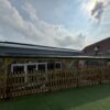 Long school canopy installed beside the building at Twyning