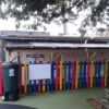 Timber playground canopy installed beside a school building at Wycliffe