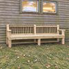 Timber park bench with a slatted backrest and armrests
