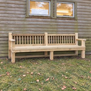 Timber park bench with a slatted backrest and armrests